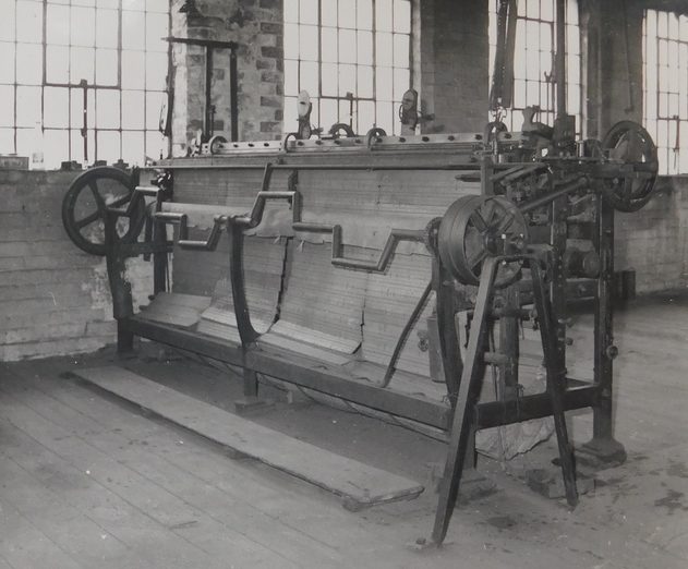 A very old industrial weaving machine